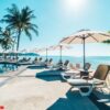 beautiful tropical beach and sea with umbrella and chair around