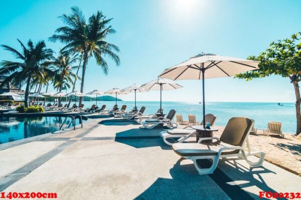 beautiful tropical beach and sea with umbrella and chair around