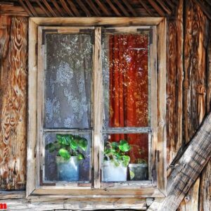 an old window on old wooden home