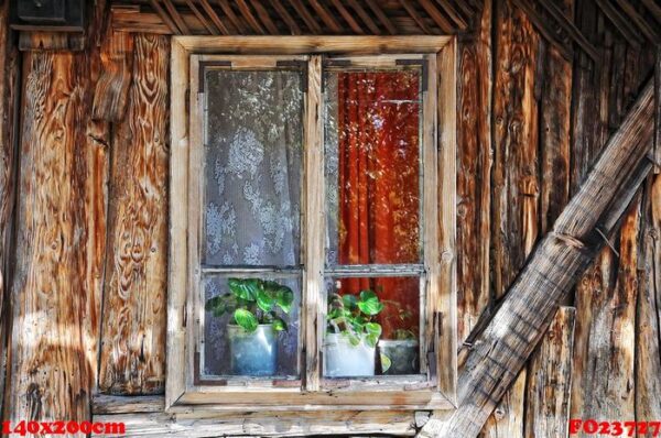 an old window on old wooden home