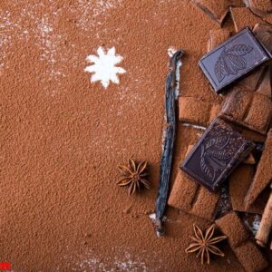 chopped chocolate with cocoa, cinnamon and vanilla stick