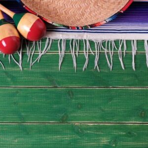 mexico mexican sombrero maracas fiesta wood background vertical