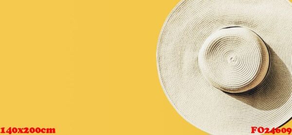 straw hat on bright yellow sunny background