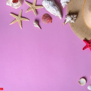 seashells on pastel violet background with straw hat summer holiday background. panton color of 2018 year