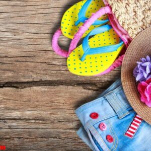 beach accessories on old wooden background