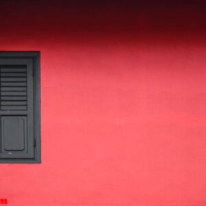 wooden window on red wall