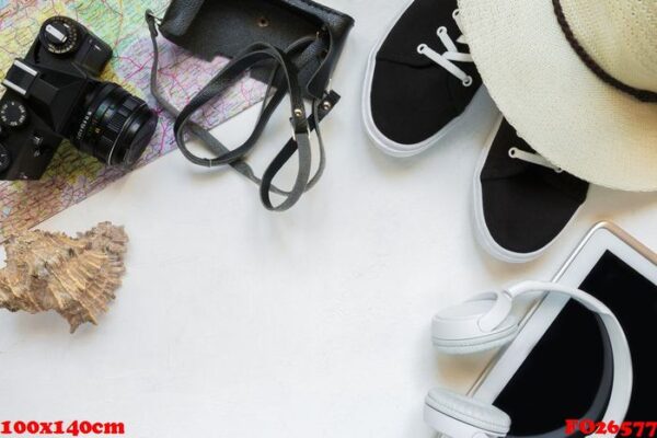 travel accessories camera, straw hat, card, shoes on a white background flat top view layout with copy space