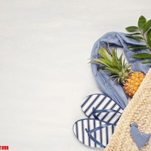 tropical beach accessories top view with straw summer bag and fl