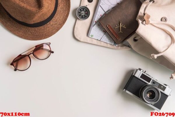 retro camera with travel accessories and items on white background with copy space, travel concept