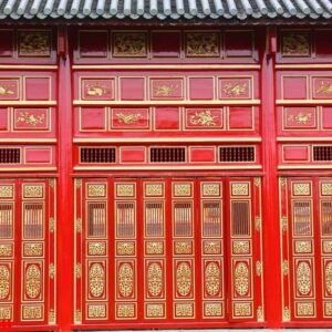 the big red carving wood doors in the hue palace