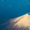 beautiful fuji mountain viewed from airplane in early winter sea