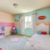 baby girl bedroom with white bed.