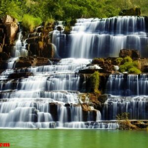 tropical rainforest landscape with flowing pongour waterfall in