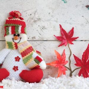 snowman sitting on snow in japan