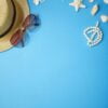 summer holiday accessories branch blue background