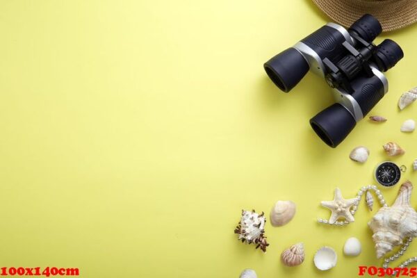 flat lay yellow suitcase with traveler accessories on yellow background