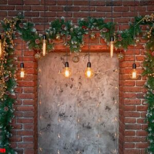 christmas decorations over the decorative fireplace on the wall