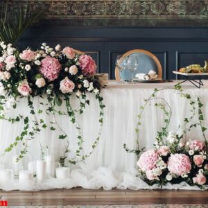 close up of flowers in sunlight.close up of roses and greenery wedding decor in sunlight.