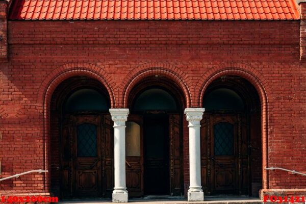 facade of an old red brick building