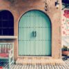 old door and wooden chair front of house