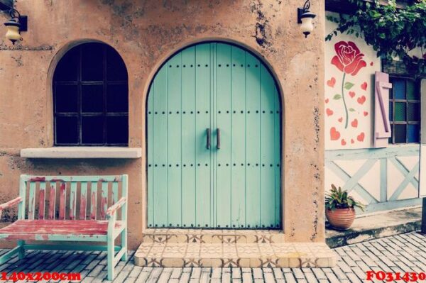 old door and wooden chair front of house