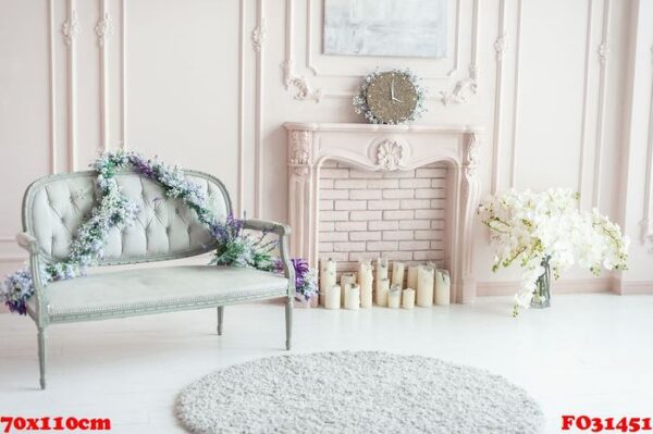 elegant pink pastel fireplace decorated with spring flowers, candles.