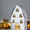 christmas background, candlestick house with lights, fir branche