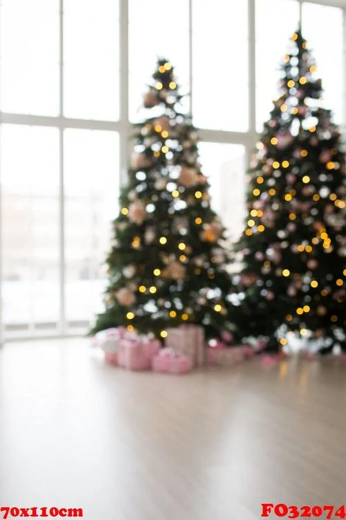 blurred background. two elegant christmas trees in a bright room. new year's and christmas