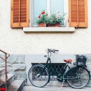 old bicycle parking front of door house