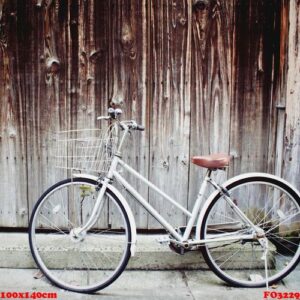 old vintage bicycle leaning against grunge wall