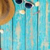 summer composition of beach accessories and seashells top view