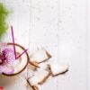 coconut on wooden table on bright blurred background