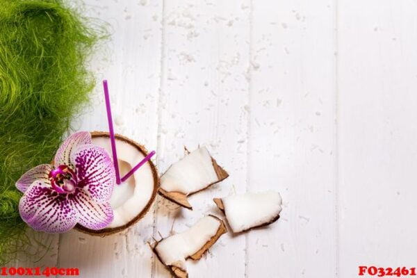 coconut on wooden table on bright blurred background