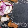 coconuts with coconuts flakes and orchid on the grey stone backg