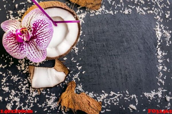 coconuts with coconuts flakes and orchid on the grey stone backg