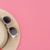 female straw hat and sunglasses for beach holiday top view