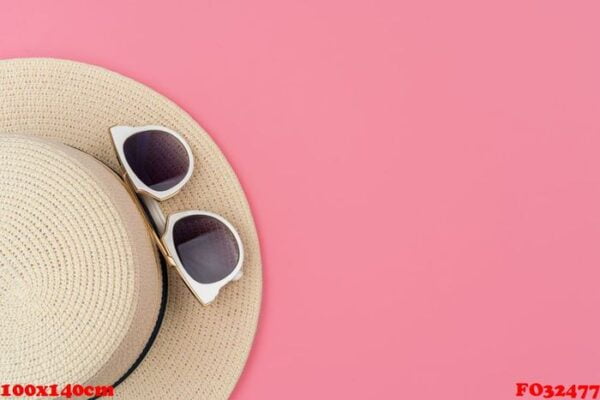 female straw hat and sunglasses for beach holiday top view