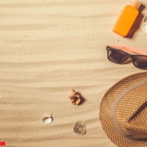 summer hat put on the tropical sand beach