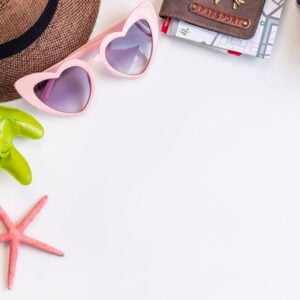 travel accessories items on white background, summer vacation concept