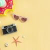 travel accessories items on color background, summer vacation concept