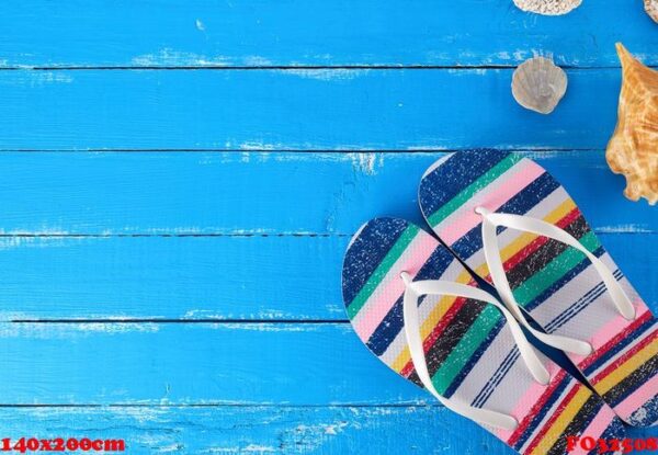 pair of female beach slippers on a blue background