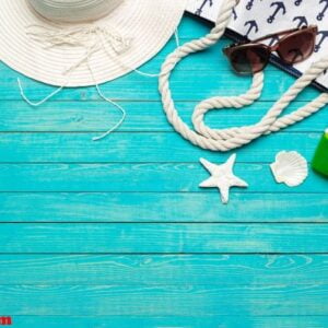 beach accessories on wooden table.