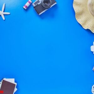 flat lay summer traveler beach accessories on blue background . travel concept, top view with copy space