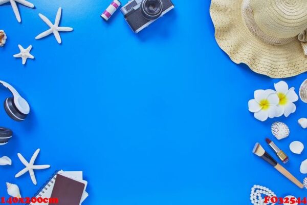 flat lay summer traveler beach accessories on blue background . travel concept, top view with copy space