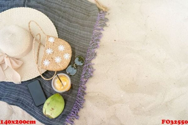 summer beach bag sea hat and sunglasses on sandy beach