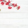 plum flowers blossom on white wood plank for chinese new year