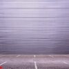 empty parking spaces on the background of a metal wall with spac