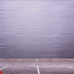 empty parking spaces on the background of a metal wall with spac