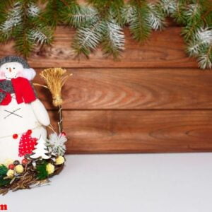 happy christmas snowman. christmas decoration on a wooden background. greeting card. xmas decoration.