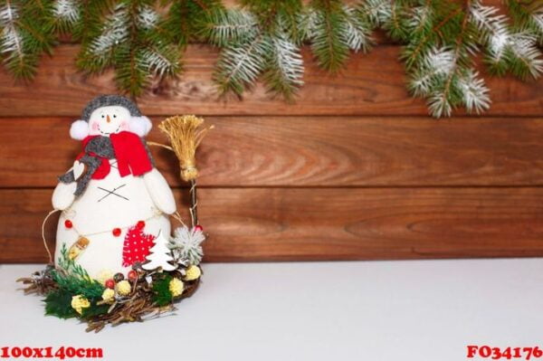 happy christmas snowman. christmas decoration on a wooden background. greeting card. xmas decoration.